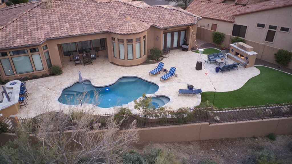 Blending Pool Remodeling With Outdoor Kitchen and Patio Design