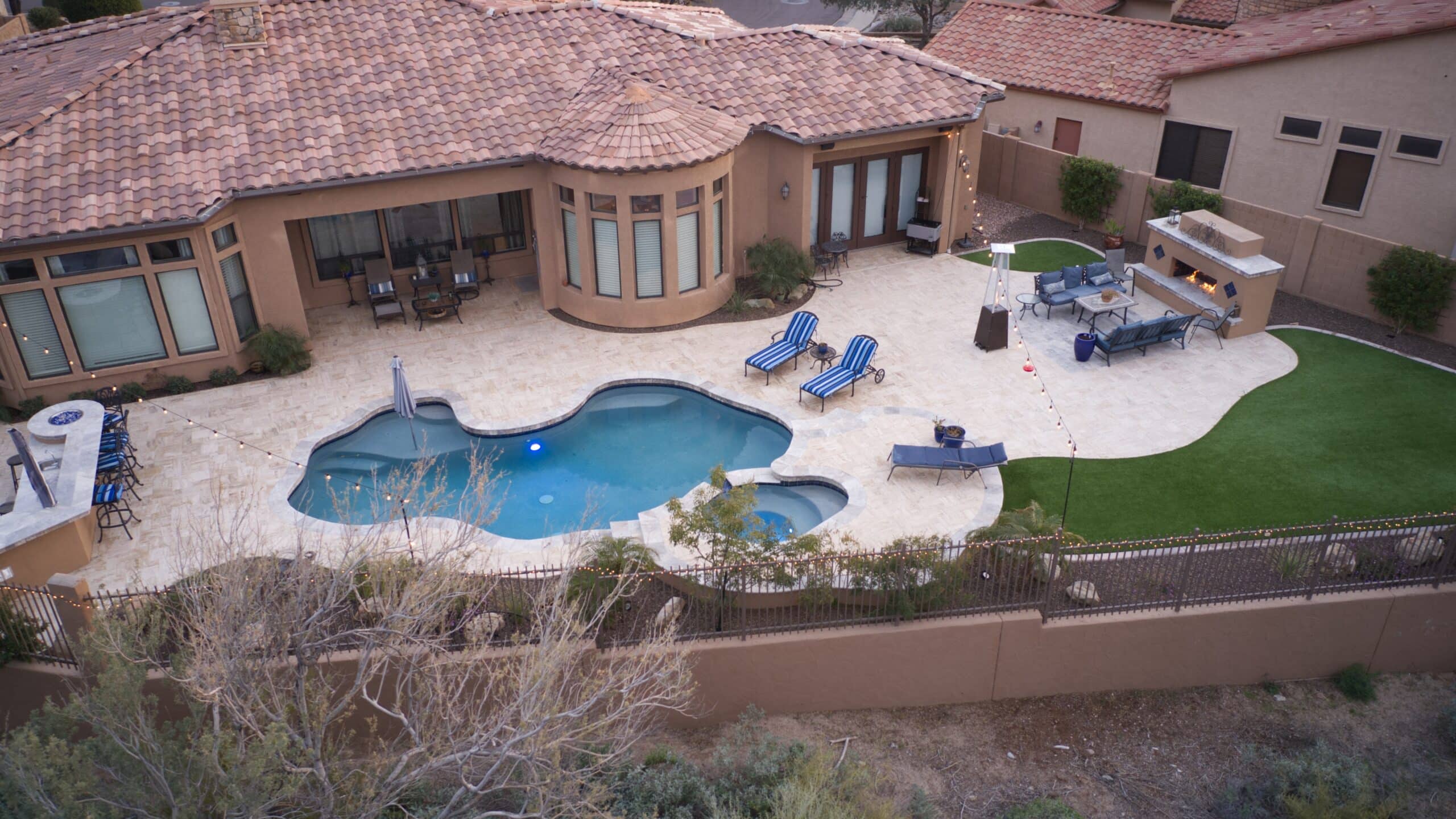 Blending Pool Remodeling With Outdoor Kitchen and Patio Design